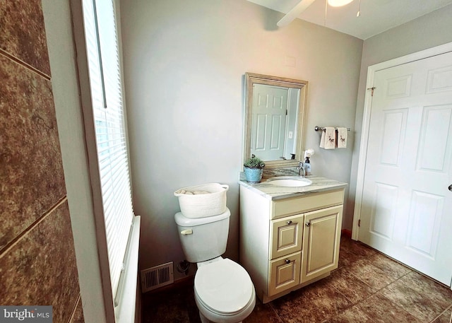 bathroom with ceiling fan, toilet, and vanity