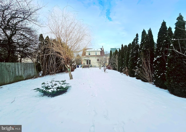 view of yard layered in snow