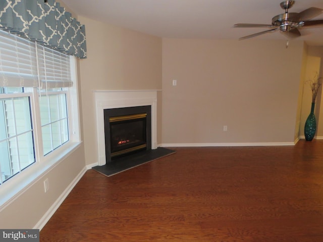 unfurnished living room with hardwood / wood-style floors and ceiling fan