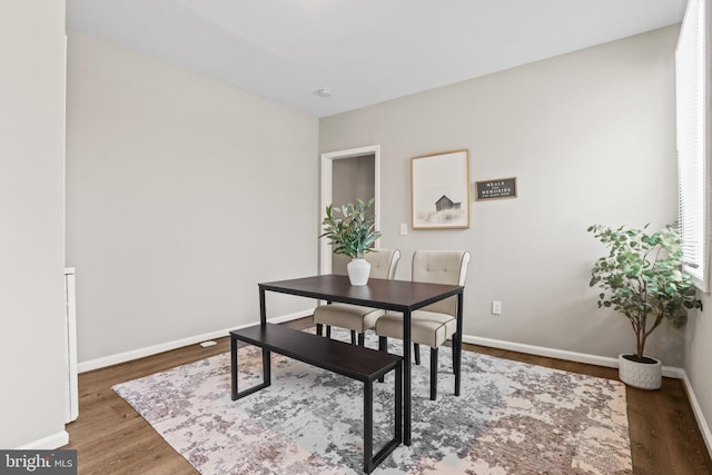 dining area featuring dark hardwood / wood-style flooring