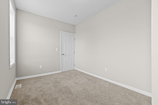 unfurnished room with carpet flooring