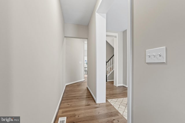 hall with light wood-type flooring