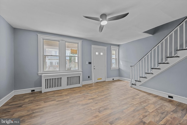 entryway with hardwood / wood-style floors and ceiling fan