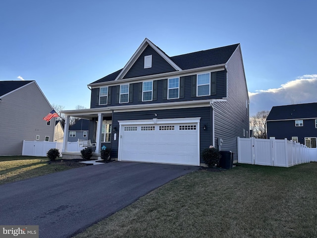 view of front of home featuring a garage and a front lawn