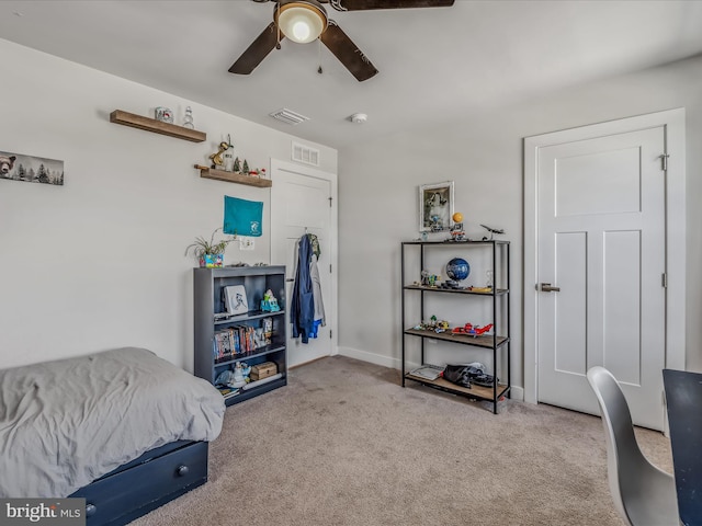 bedroom with light carpet and ceiling fan