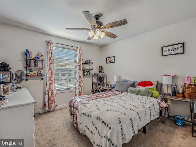 carpeted bedroom featuring ceiling fan