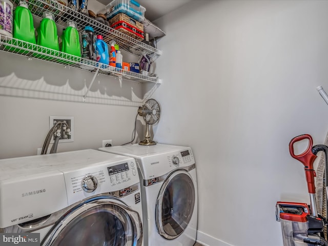 washroom featuring washing machine and dryer