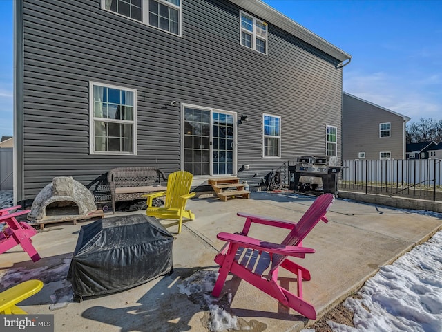 back of property with a patio