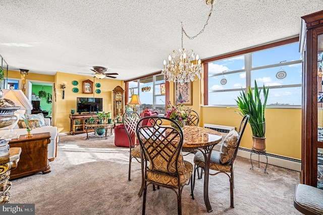 dining area with baseboard heating, a textured ceiling, carpet floors, and ceiling fan with notable chandelier