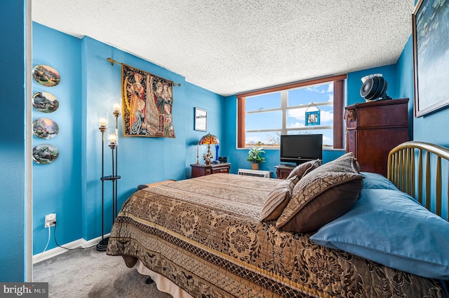 carpeted bedroom with a textured ceiling