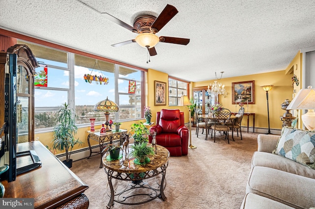 living room with carpet, ceiling fan with notable chandelier, a textured ceiling, and a baseboard heating unit