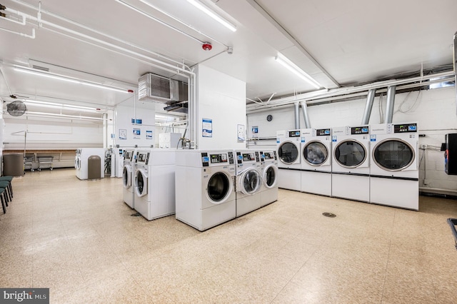 laundry room with washing machine and clothes dryer