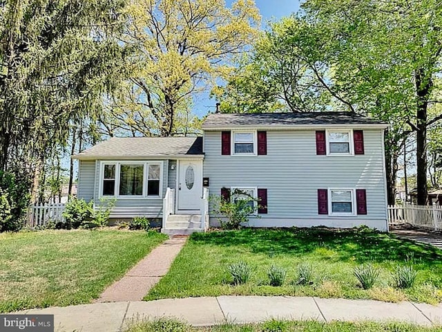 split level home featuring a front yard