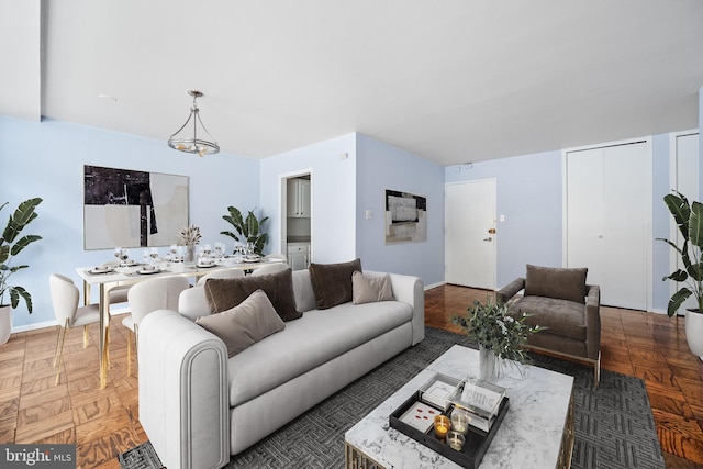 living room with an inviting chandelier