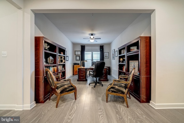 office space with ceiling fan and light hardwood / wood-style flooring