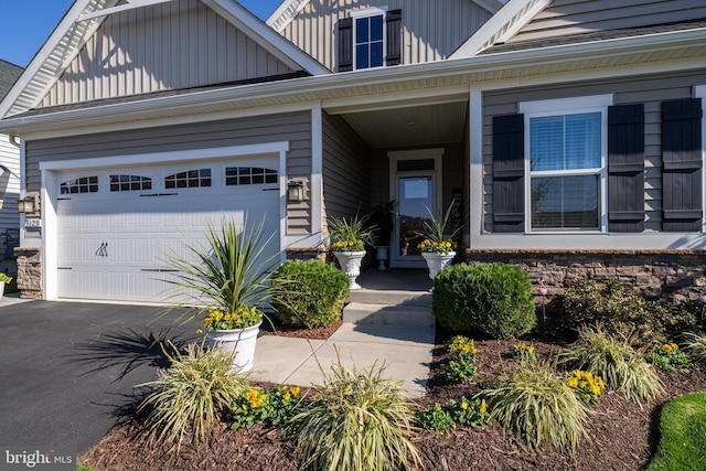 view of exterior entry with a garage