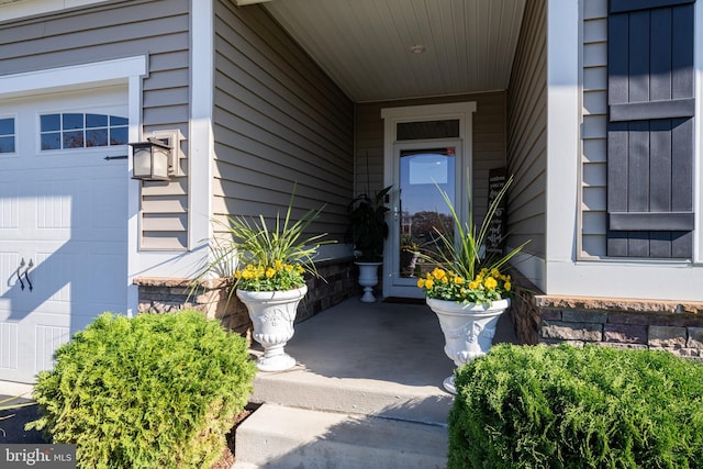 view of exterior entry featuring a garage