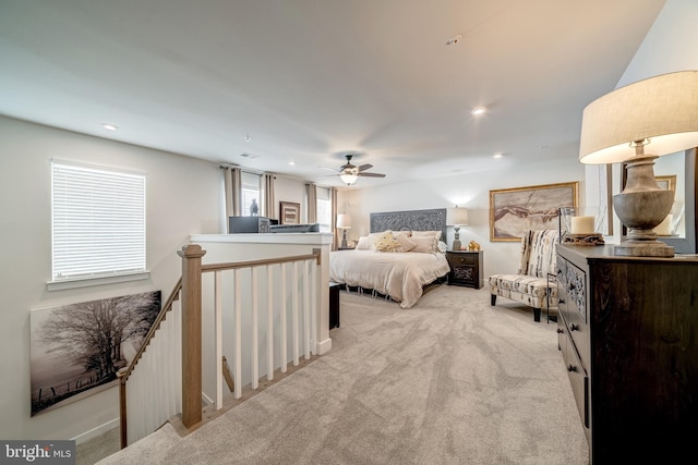 bedroom with light carpet and ceiling fan