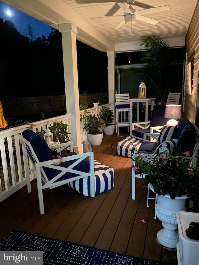 deck with ceiling fan and a porch