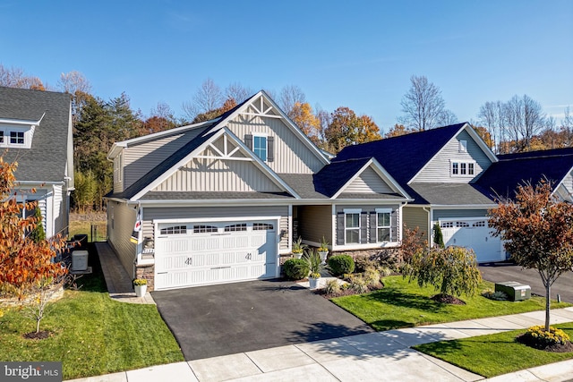 view of front of home with a garage, a front lawn, and central air condition unit