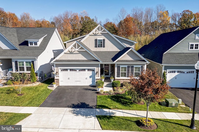 view of front facade with a garage and a front lawn