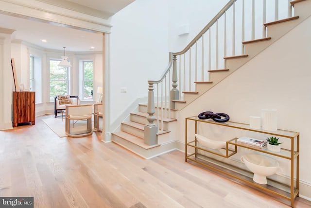 staircase with hardwood / wood-style flooring