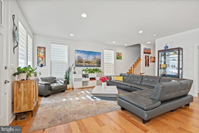 living room featuring light hardwood / wood-style floors and plenty of natural light