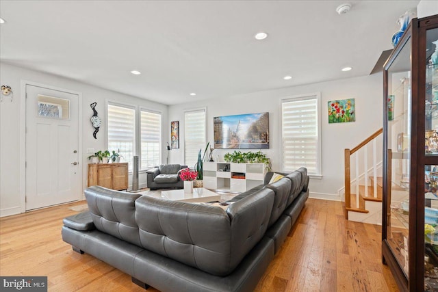 living room with light hardwood / wood-style flooring