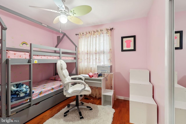 bedroom featuring ceiling fan and dark hardwood / wood-style floors