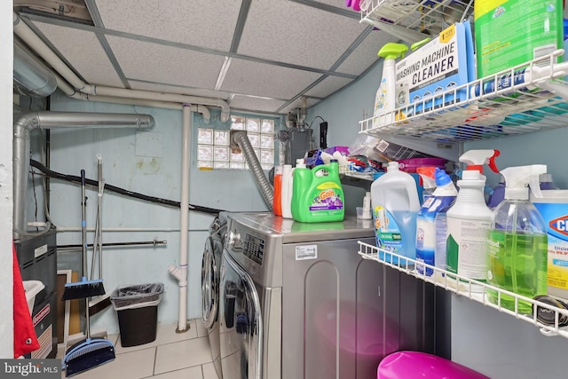 laundry area featuring tile patterned floors and separate washer and dryer