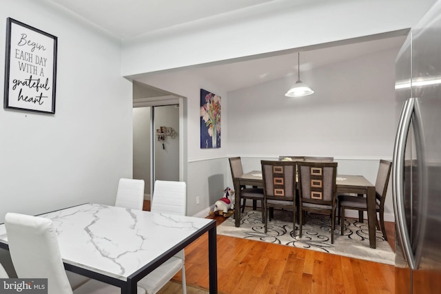 dining space with light hardwood / wood-style flooring