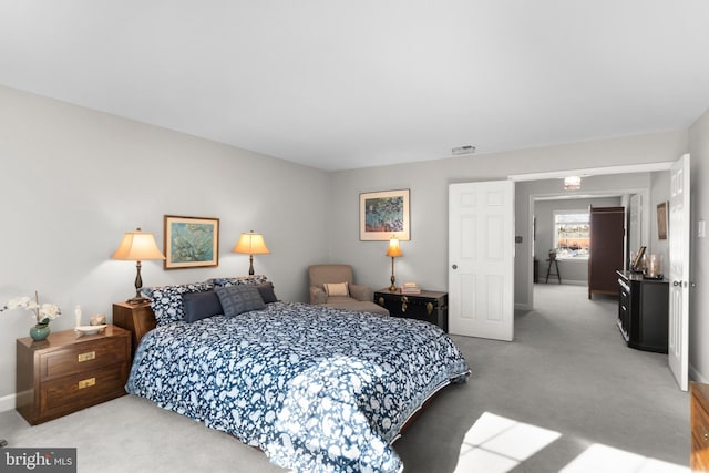 bedroom with light colored carpet