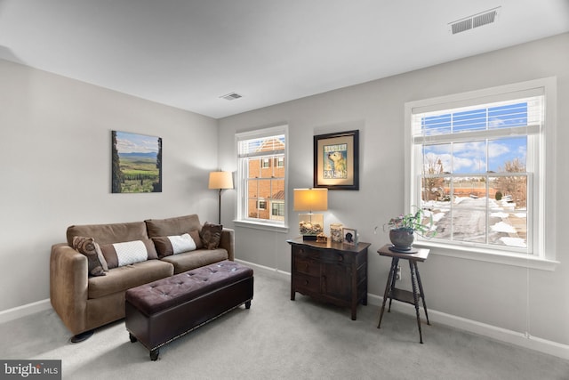 living room with carpet and plenty of natural light