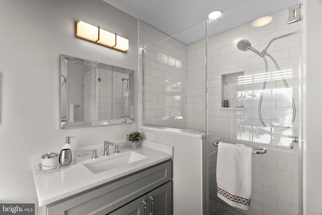 bathroom featuring vanity and walk in shower