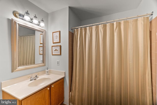 bathroom featuring vanity and walk in shower