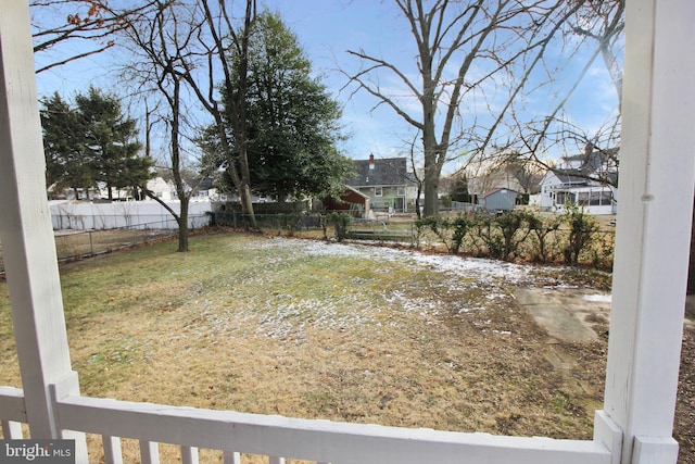 view of yard featuring a residential view and fence