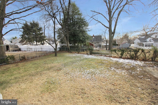 view of yard with a residential view and fence