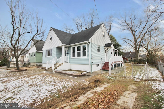 view of front of house with fence and a gate