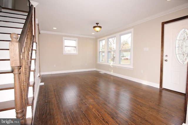 entrance foyer featuring dark wood-style floors, stairs, baseboards, and ornamental molding