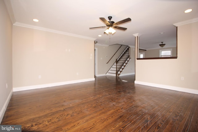 unfurnished living room featuring stairs, crown molding, wood finished floors, and baseboards