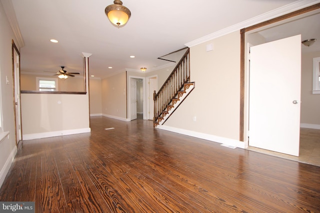 interior space featuring stairs, wood finished floors, baseboards, and ornamental molding