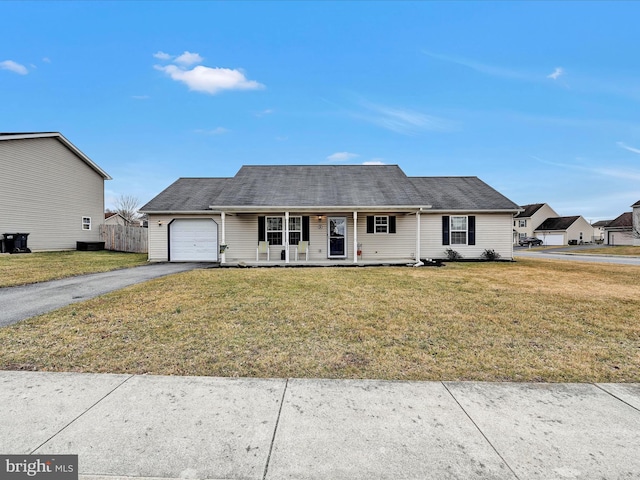 view of front of house with aphalt driveway, a porch, an attached garage, fence, and a front lawn