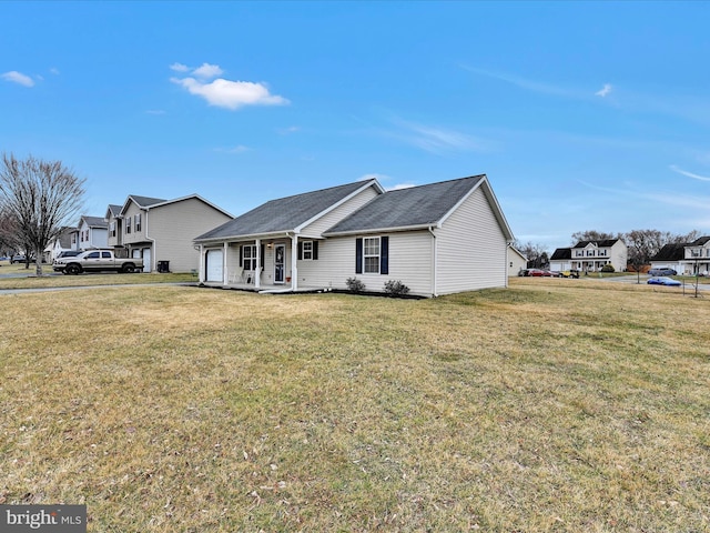 single story home with covered porch and a front lawn