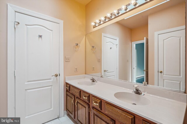 bathroom with vanity and tile patterned flooring