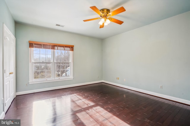 empty room with wood-type flooring and ceiling fan