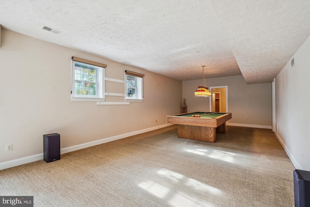 recreation room featuring billiards, carpet flooring, and a textured ceiling