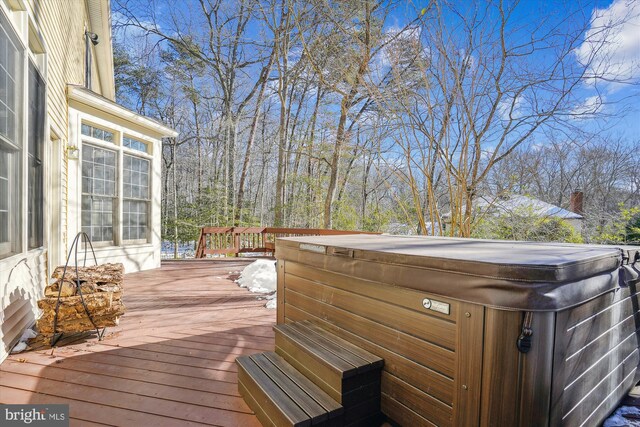 deck featuring a hot tub