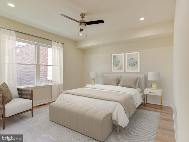 bedroom featuring ceiling fan and light wood-type flooring