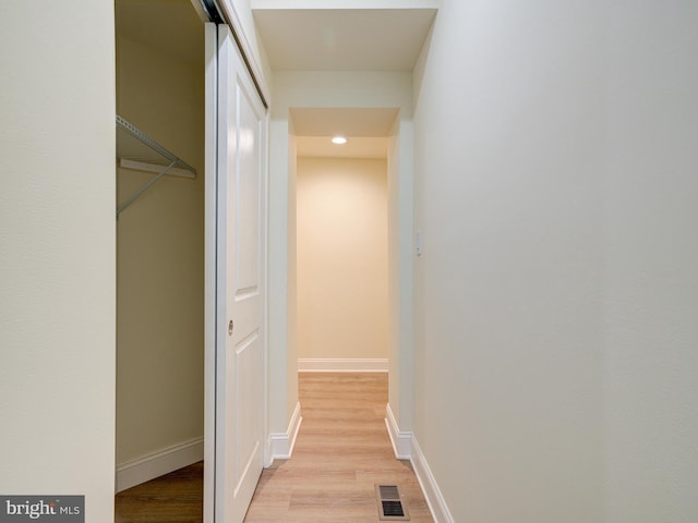 hallway featuring light hardwood / wood-style flooring