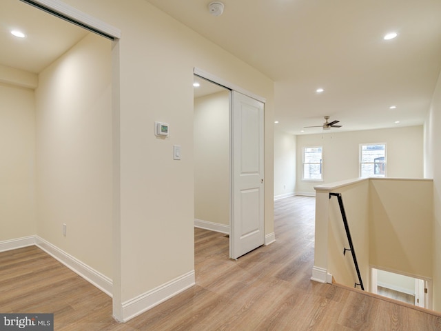 hall with light wood-type flooring